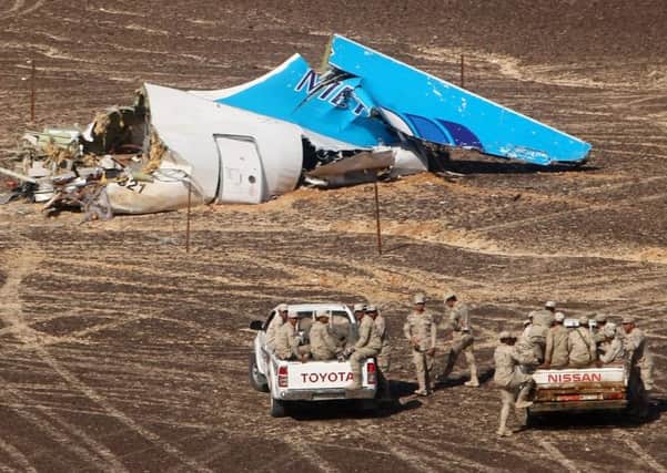 Members of the Egyptian forces prepare to examine the wreckage of the Russian plane. Picture: AP