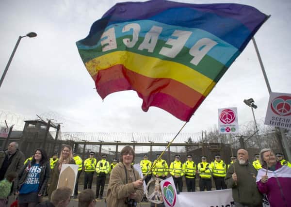 Hundreds of protesters stage a blockade at HM Naval Base Clyde at Faslane , Scotland, earlier this year. Picture: Jane Barlow