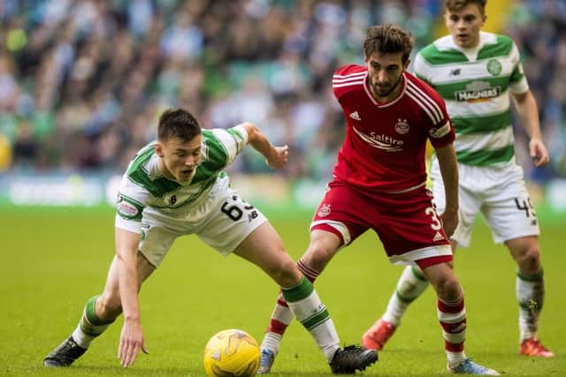 Celtic's Kieran Tierney (left) and Aberdeen's Graeme Shinnie compete for the ball. Picture: PA