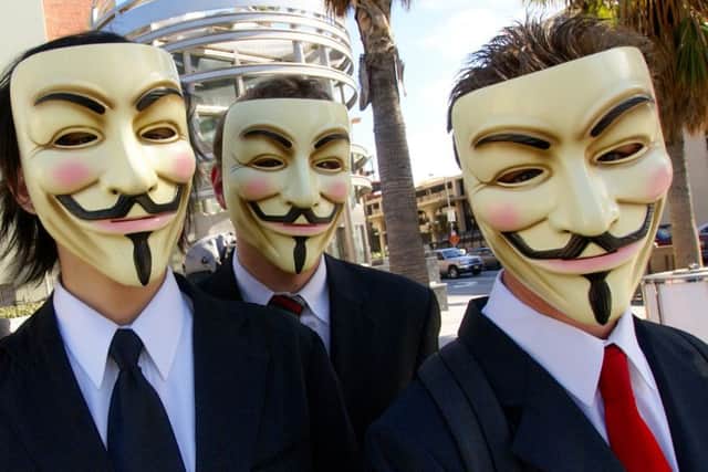 Picture: Activist group Annoymous can often be seen wearing Guy Fawkes masks