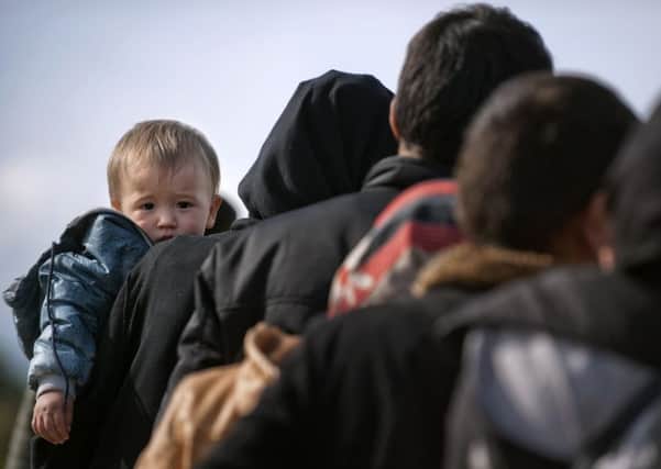 Wheatleys donation of £5,000 to the charity helped meet the costs of transporting a 40-foot container full of clothes to refugees in the Balkans. Picture: AFP/Getty Images