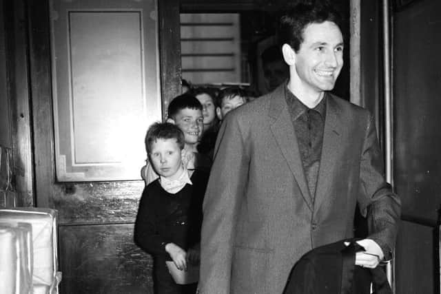 Donegan arrives for a rehearsal of the first ever Royal Scottish Variety Show being held in the presence of the Queen and the Duke of Edinburgh at the Alhambra theatre Glasgow, July 1958.