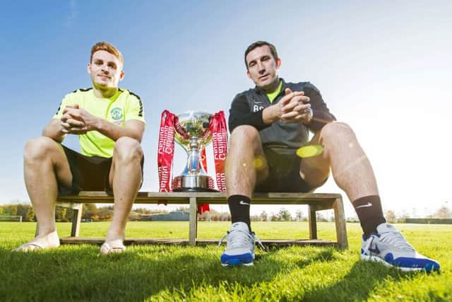 Hibs manager Alan Stubbs, who is relaxed about reports linking Jason Cummings with English clubs, poses with  midfielder Fraser Fyvie ahead of tonights cup tie. Picture: SNS Group