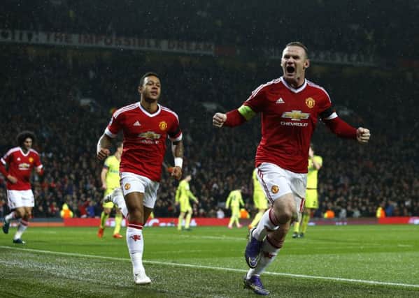 Wayne Rooney celebrates after his 79th-minute goal gave United victory at Old Trafford last night. Picture: AP