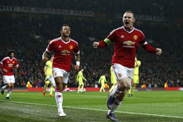 Wayne Rooney celebrates after his 79th-minute goal gave United victory at Old Trafford last night. Picture: AP