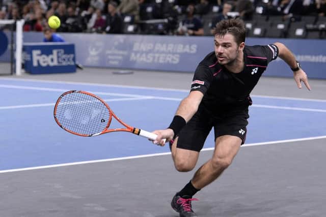 Stan Wawrinka returns the ball to Bernard Tomic during their second round tennis match at the ATP World Tour Masters in Paris. Picture: AFP/Getty Images