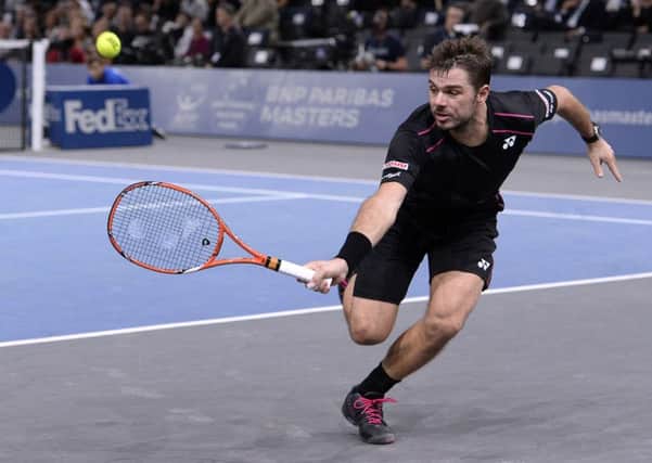 Stan Wawrinka returns the ball to Bernard Tomic during their second round tennis match at the ATP World Tour Masters in Paris. Picture: AFP/Getty Images