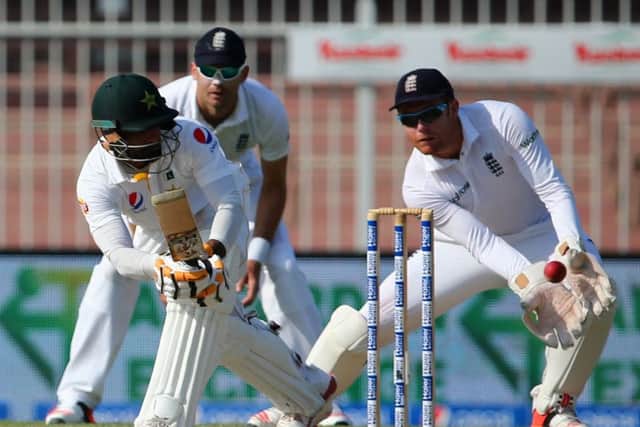 England's wicket keeper Jonny Baistow (right) tries to catch the ball played by Pakistan's Mohammad Hafeez (left). Picture: AFP/Getty Images