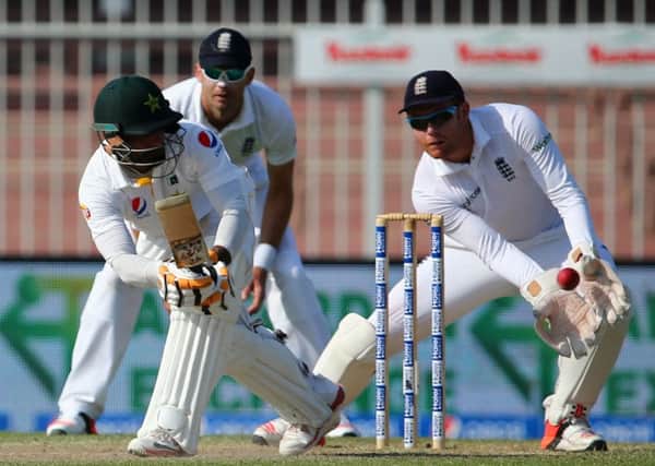 England's wicket keeper Jonny Baistow (right) tries to catch the ball played by Pakistan's Mohammad Hafeez (left). Picture: AFP/Getty Images