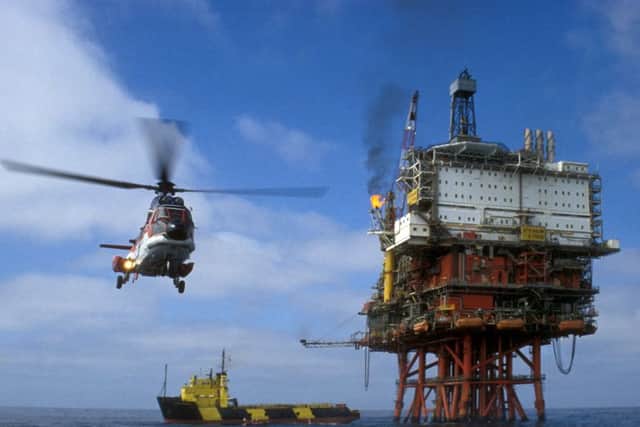 Scotland's growth forecasts have been trimmed as the oil downturn hits other parts of the economy