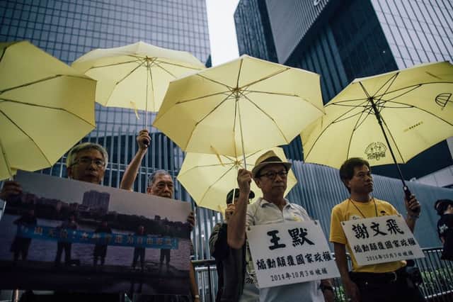 People holding umbrellas took to the streets of Hong Kong in September, a year on from the Occupy Central series of protests  also known as the Umbrella Movement  against Beijing's decision on reforms to the electoral system. Picture: Getty