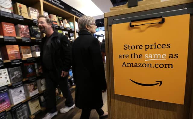 Customers shop at the opening day for Amazon Books, the first brick-and-mortar retail store for online retail giant Amazon, in Seattle. Picture: AP