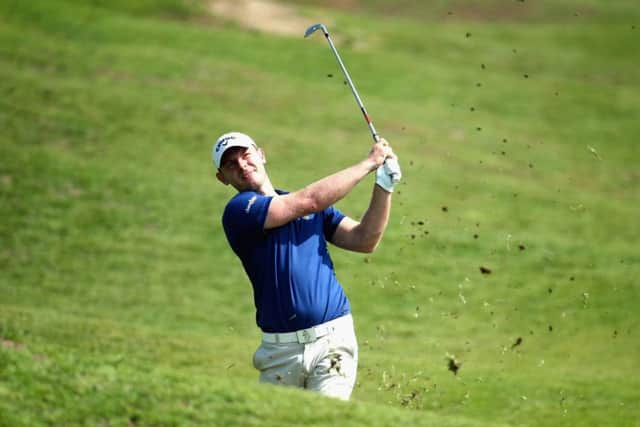 Scotland's Scott Henry of Scotland plays his second shot into the 16th green en route to a 69 at the NBO Golf Classic Grand Final at the Almouj Golf Club in Muscat, Oman.  Picture: Warren Little/Getty Images
