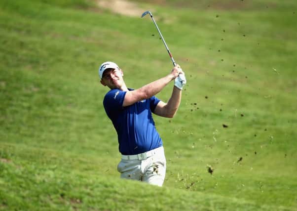Scotland's Scott Henry of Scotland plays his second shot into the 16th green en route to a 69 at the NBO Golf Classic Grand Final at the Almouj Golf Club in Muscat, Oman.  Picture: Warren Little/Getty Images