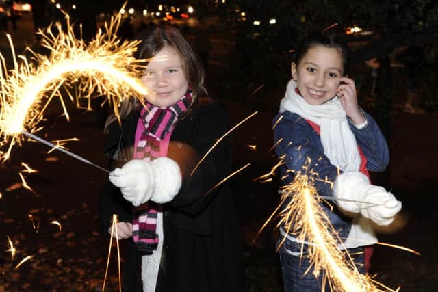Caitlyn Turner and Morgan Walker enjoy the fireworks at Edinburgh's Meadowbank Stadium. Picture: Ian Rutherford