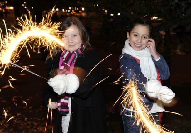 Caitlyn Turner and Morgan Walker enjoy the fireworks at Edinburgh's Meadowbank Stadium. Picture: Ian Rutherford