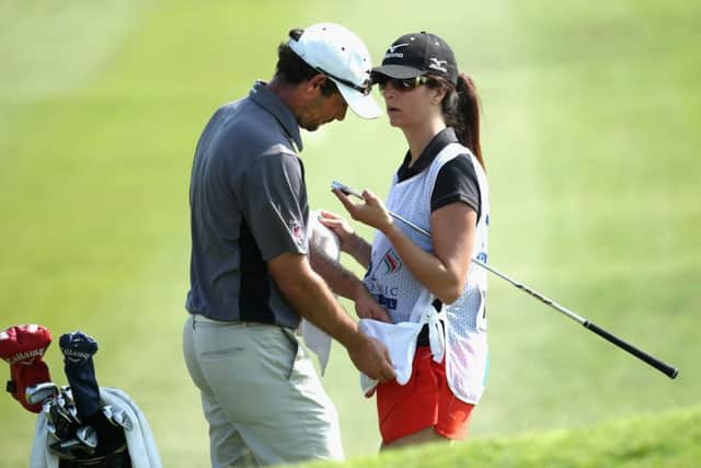 Peter Whiteford with his wife and caddie, Gabby, during his first-round 73 in Muscat, Oman. Picture: Getty