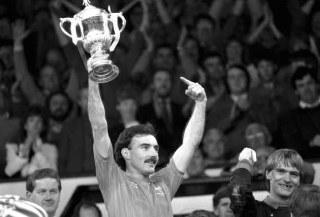 Willie Miller lifts the Scottish Cup in 1984 following Aberdeen's victory over Celtic