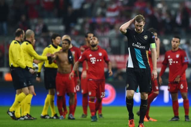 Per Mertesacker looks dejected following the final whistle. Picture: Getty