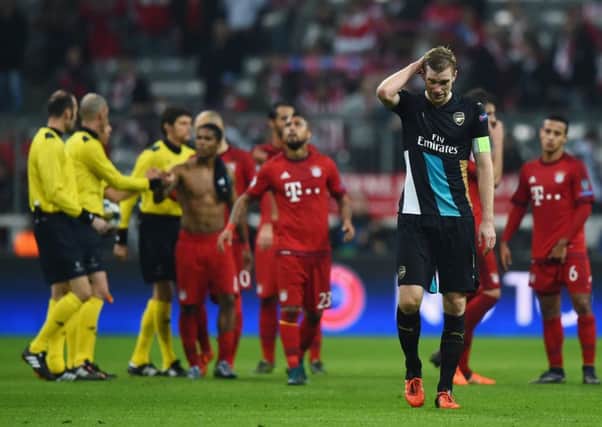 Per Mertesacker looks dejected following the final whistle. Picture: Getty