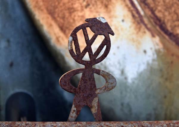A mannequin with the logo of VW on a rusty vintage Beetle car in Usseln, Germany. Picture: AFP/Getty Images