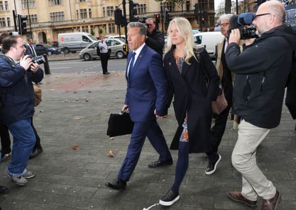 Neil Fox arrives at court with wife Vicky yesterday. He denies two counts of sexual assault and eight of indecent assault. Picture: Getty Images
