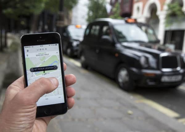 The Uber app in use in London. Picture: Getty