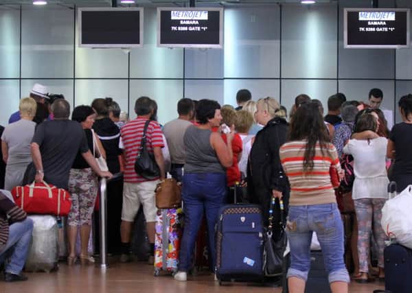 Tourists que inside the airport in Egypt's Red Sea resort of Sharm El-Sheikh. Picture: AFP/Getty Images