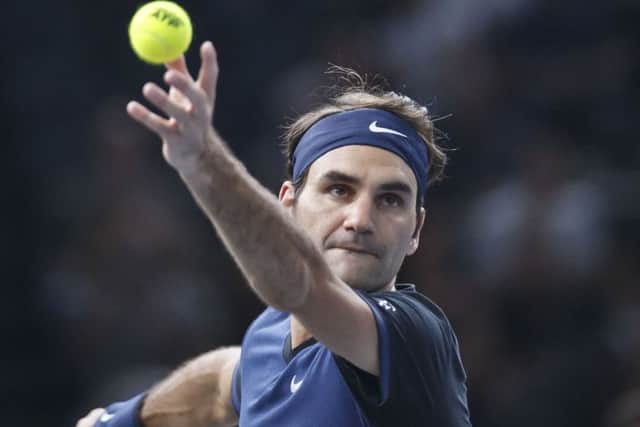 Roger Feder serves the ball to John Isner in Paris. Picture: AP