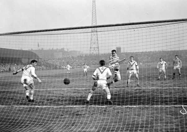 John Divers scores at Parkhead in a clash with Airdrie.
