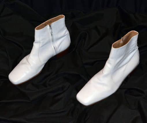 A pair of white Verde boots worn by Elvis Presley during his 1968 performance of If I Can Dream. Picture: PA