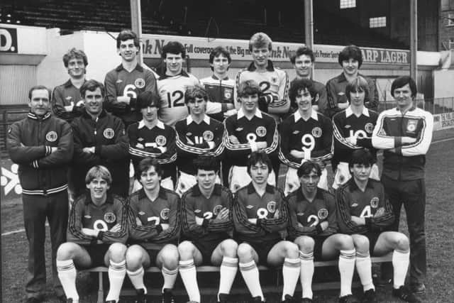 The Scotland under-18 squad pictured before a training session at Easter Road in February 1982, three months before the European Championship.  Front row, left to right;  Gary Mackay, John Hendrie, Eric Black, Billy Davies, Jim McInally, Jim Dobbin.  Middle row; trainer Tom McNiven, coach Ross Mathie, Reynolds, Ally Dick, Clarke, Chalmers, Anderson, manager Andy Roxburgh.  Back row; Dave Bowman, Dave McPherson, Robin Rae, Dave Beaumont, Bryan Gunn , Billy Livingstone, John Philliben.