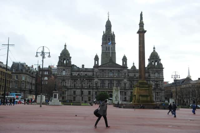 Glasgow's George Square in 2013, before the red surface was removed. Picture: Robert Perry