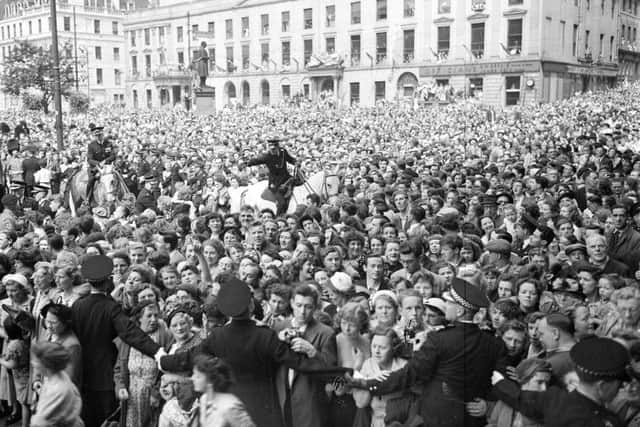 Crowds gather in George Square for a royal visit in 1953. Picture: TSPL