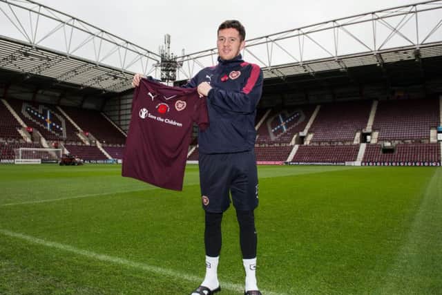 Danny Swanson shows off Hearts poppy appeal strip that will be worn today against Hamilton. Picture: SNS