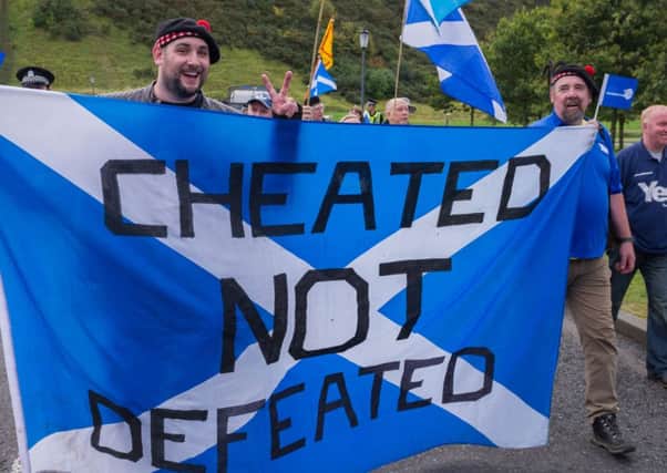Three hundred people march on the Scottish Parliament on the anniversary of the independence referendum. Picture: Steven Scott Taylor/JP