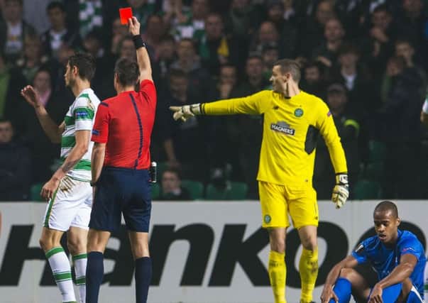 Celtic's Nir Bitton is shown a red card by referee Slavko Vincic. Picture: Bill Murray/SNS