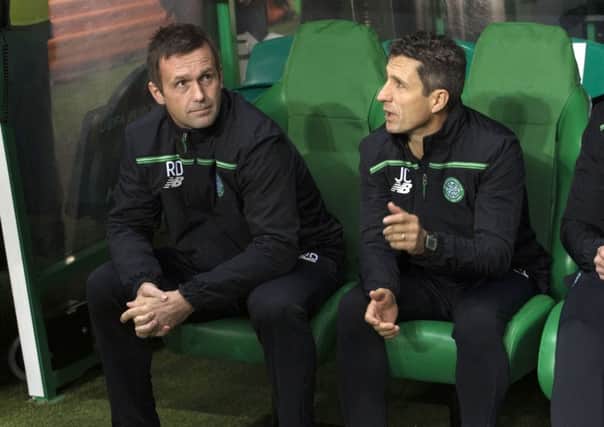 Ronny Deila (left) and John Collins look on as their side go down to Molde. Picture: SNS