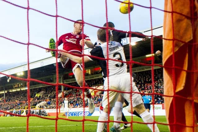 Aberdeen's Adam Rooney (centre) makes it 1-0. Picture: SNS Group