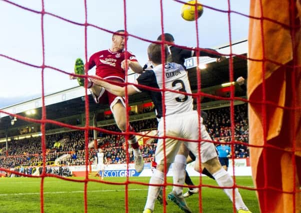 Aberdeen's Adam Rooney (centre) makes it 1-0. Picture: SNS Group
