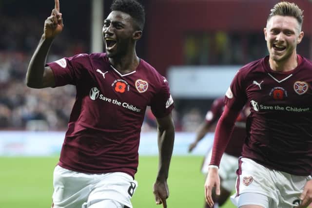 Prince Buaben (left) celebrates after opening the scoring for Hearts. Picture: SNS Group