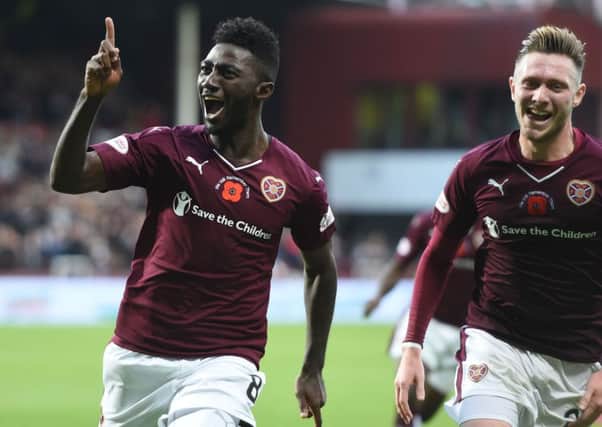 Prince Buaben (left) celebrates after opening the scoring for Hearts. Picture: SNS Group