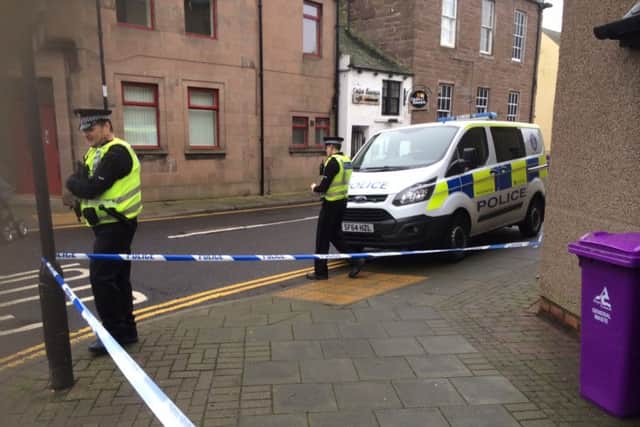 Police on  Market Street in Montrose. Picture: JP
