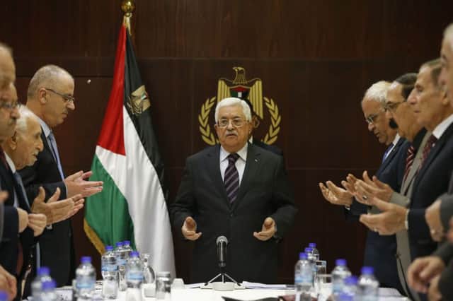 Palestinian president Mahmud Abbas prays with member of his Fatah executive in Ramallah. Picture: Getty