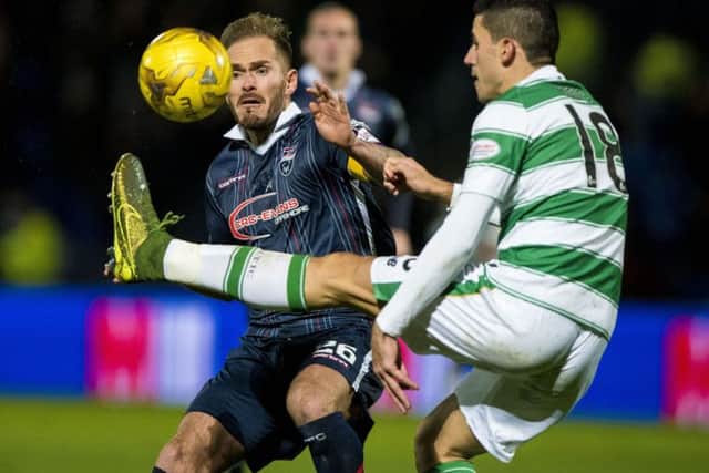 Ross County's Martin Woods and Celtic's Tomas Rogic. Picture: PA