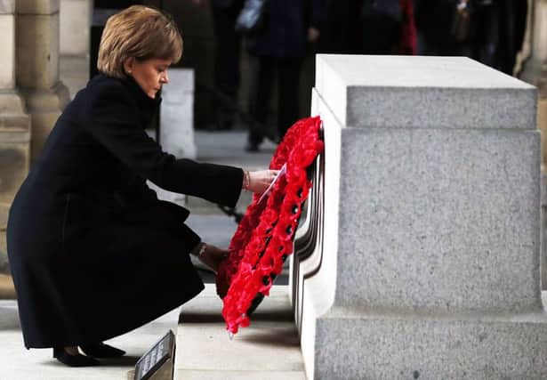 First Minister Nicola Sturgeon lays a wreath at the Stone of Remembrance in Edinburgh. Picture: PA