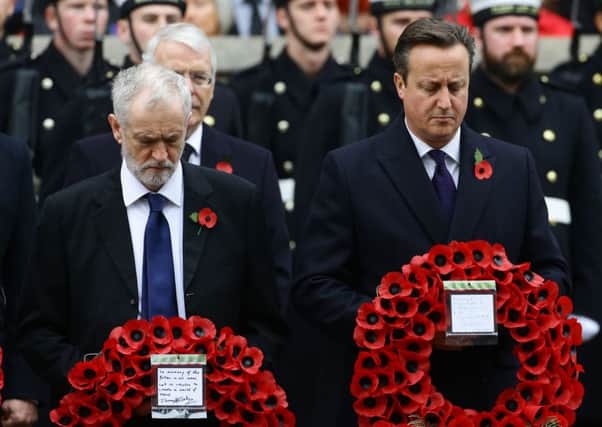 Jeremy Corbyn and Prime Minister David Cameron at the Cenotaph yesterday. Picture: PA