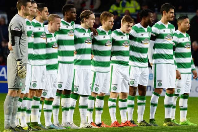 The Celtic players observe a minute's silence yesterday. Picture: SNS Group