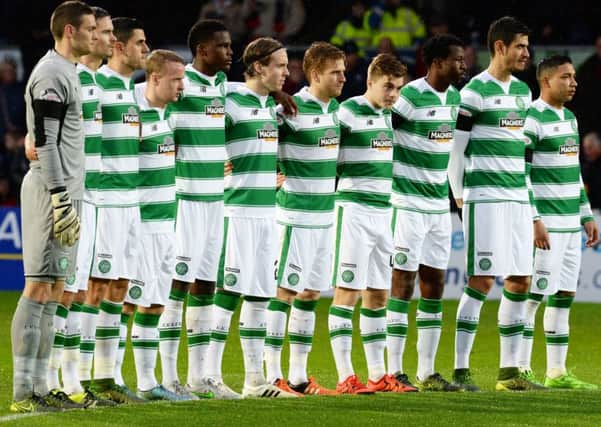 The Celtic players observe a minute's silence yesterday. Picture: SNS Group