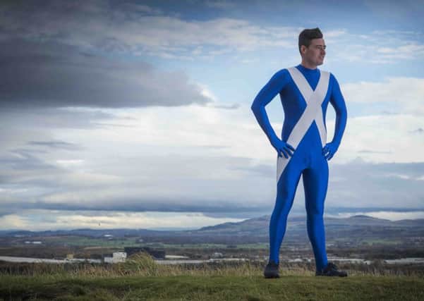 Josh Quigley is raising awareness of mental health issues by travelling around the world visiting charities and other countries dressed in a saltire morphsuit and a kilt.  Picture: Alex Hewit